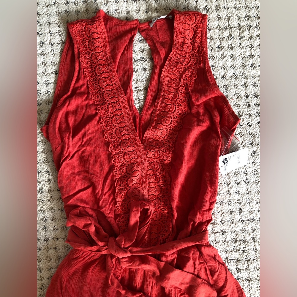 Charlotte Russe orange romper with tie in size small. New with tag